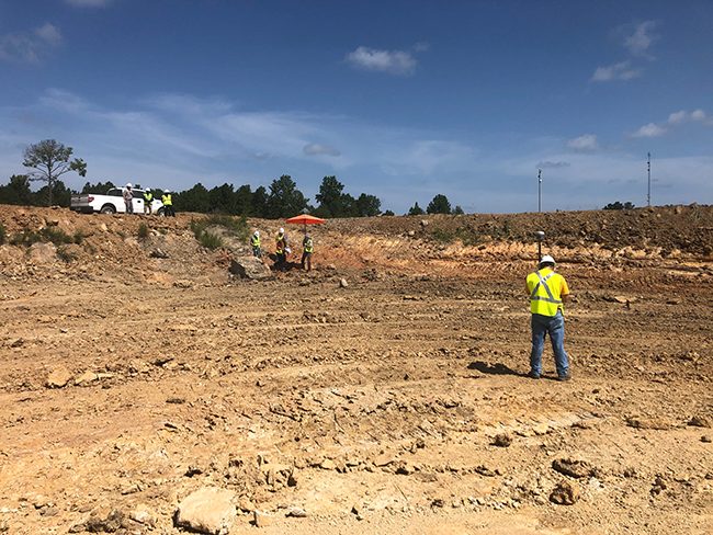 EMS surveyor performing construction staking and layout